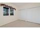 Neutral bedroom with ample closet space and scenic view from window at 265 Ox Yoke Way, Monument, CO 80132