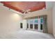Spacious bedroom with ceiling design, large windows leading to a private deck, and ample space at 265 Ox Yoke Way, Monument, CO 80132