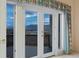 Close up of French doors leading to private deck with mountain view in spacious bedroom at 265 Ox Yoke Way, Monument, CO 80132