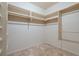Walk-in closet with built-in shelving and wooden racks, offering ample storage space at 265 Ox Yoke Way, Monument, CO 80132