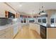 Bright kitchen features light cabinets, granite counters, stainless appliances, and mountain views at 265 Ox Yoke Way, Monument, CO 80132