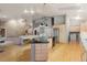 Kitchen with granite counters, stainless appliances, laundry area, and open to living space at 265 Ox Yoke Way, Monument, CO 80132