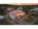 Well-maintained home with an expansive rear exterior and charming balcony at dusk at 265 Ox Yoke Way, Monument, CO 80132