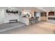 Finished basement with a wet bar, fireplace, carpeted floors, and a neutral color scheme at 11020 E 150Th Pl, Brighton, CO 80602