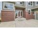 Front door of this property with brick accents and a concrete porch, creating a welcoming entrance at 11020 E 150Th Pl, Brighton, CO 80602