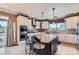 Modern kitchen featuring stainless steel appliances, a center island, and ample cabinet space at 11020 E 150Th Pl, Brighton, CO 80602