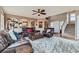 Bright living room featuring plush seating, hardwood floors, and an open floor plan at 11020 E 150Th Pl, Brighton, CO 80602
