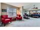 Spacious primary bedroom suite includes sitting area, ceiling fan, and large windows at 11020 E 150Th Pl, Brighton, CO 80602