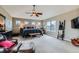 Spacious primary bedroom featuring a ceiling fan and large windows with views of the outdoors at 11020 E 150Th Pl, Brighton, CO 80602