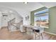 Inviting dining area featuring natural light, wood floors, and seamless flow into the living space at 4407 N Quemoy St, Aurora, CO 80019