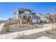 Attractive two-story home with stone accents, a welcoming porch, and manicured front landscaping at 4407 N Quemoy St, Aurora, CO 80019
