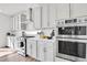 Gourmet kitchen with stainless steel appliances, ample cabinets, and countertops at 4407 N Quemoy St, Aurora, CO 80019