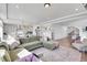 Expansive living area with hardwood floors, an open layout, and seamless connection to the kitchen and dining space at 4407 N Quemoy St, Aurora, CO 80019