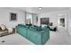 Cozy living room featuring plush seating and large window at 4407 N Quemoy St, Aurora, CO 80019