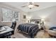 Bedroom featuring neutral walls, a window with blinds, and an accent wall decor at 4185 Cheyenne Dr, Larkspur, CO 80118