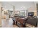 Spacious finished basement with pool table, bar area, home theater, and foosball table at 4185 Cheyenne Dr, Larkspur, CO 80118