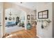 Inviting home entrance leading to a living room with a cozy couch and staircase at 4185 Cheyenne Dr, Larkspur, CO 80118