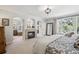 Main bedroom showcasing a fireplace and access to the main bathroom at 4185 Cheyenne Dr, Larkspur, CO 80118