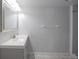 Bathroom with a white vanity and a large mirror at 11397 Kendall St, Westminster, CO 80020