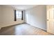This bedroom offers a closet and a window dressed with dark curtains at 11397 Kendall St, Westminster, CO 80020