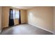Bright bedroom featuring neutral walls, a window with dark curtains and light wood-look flooring at 11397 Kendall St, Westminster, CO 80020
