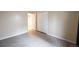 Comfortable bedroom offers a large closet and an open door and light wood-look flooring at 11397 Kendall St, Westminster, CO 80020