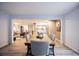 Open concept dining room flows into the kitchen and living room, creating an inviting space for entertaining at 11397 Kendall St, Westminster, CO 80020