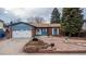 Well-maintained single Gathering home with beautiful landscaping, mature trees, and inviting entrance at 11397 Kendall St, Westminster, CO 80020