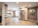 Spacious kitchen featuring stainless steel appliances, ample cabinet space, and modern wood flooring at 11397 Kendall St, Westminster, CO 80020
