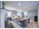 View of living room boasts recessed lights, sleek wood floors and stylish décor, and a cozy fireplace at 11397 Kendall St, Westminster, CO 80020