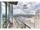 Enjoy city views from this condo's private balcony with glass railings and a seating area at 891 14Th St # 2002, Denver, CO 80202