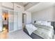 Bright and airy bedroom showcasing a large window, comfortable bedding, and natural light at 891 14Th St # 2002, Denver, CO 80202