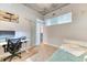 Bright bedroom with large window, modern desk, and minimalist decor at 891 14Th St # 2002, Denver, CO 80202