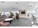 Stylish common area with comfortable seating, a large TV, and panoramic city views at 891 14Th St # 2002, Denver, CO 80202