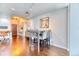 Dining area featuring a table set for four, hardwood floors, and modern lighting at 891 14Th St # 2002, Denver, CO 80202