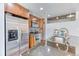 Modern condo kitchen featuring stainless steel appliances, granite countertops, and stylish cabinetry at 891 14Th St # 2002, Denver, CO 80202