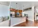 Well-equipped condo kitchen with stainless steel appliances, a breakfast bar, and dark wood cabinets at 891 14Th St # 2002, Denver, CO 80202