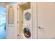 Convenient laundry area with stacked washer and dryer at 891 14Th St # 2002, Denver, CO 80202