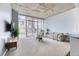 Bright condo living room with large windows offering city views, comfortable seating, and modern decor at 891 14Th St # 2002, Denver, CO 80202