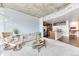 Open-concept condo living area with sleek decor, a cozy couch, and a modern kitchen at 891 14Th St # 2002, Denver, CO 80202