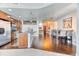 Open-concept living space with modern kitchen, dining area, and hardwood floors throughout at 891 14Th St # 2002, Denver, CO 80202