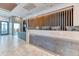 Modern condo lobby with a reception desk, decorative lighting, and sleek finishes at 891 14Th St # 2002, Denver, CO 80202