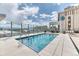 Rooftop pool offers stunning views, surrounded by sleek decking and modern glass railing at 891 14Th St # 2002, Denver, CO 80202