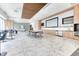Spacious recreation room offers seating, dining, and kitchen area with modern design elements at 891 14Th St # 2002, Denver, CO 80202