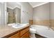 Bathroom features a tub and shower at 9451 Ashbury Cir # 202, Parker, CO 80134