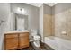Clean bathroom with single vanity, toilet and bathtub at 9451 Ashbury Cir # 202, Parker, CO 80134