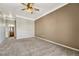 Spacious bedroom with carpeted floor and ceiling fan at 9451 Ashbury Cir # 202, Parker, CO 80134