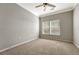 Spacious bedroom with a window and ceiling fan at 9451 Ashbury Cir # 202, Parker, CO 80134