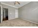 Bedroom with carpet flooring and access to hallway at 9451 Ashbury Cir # 202, Parker, CO 80134