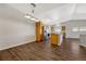 Dining area with hardwood floors and kitchen views at 9451 Ashbury Cir # 202, Parker, CO 80134